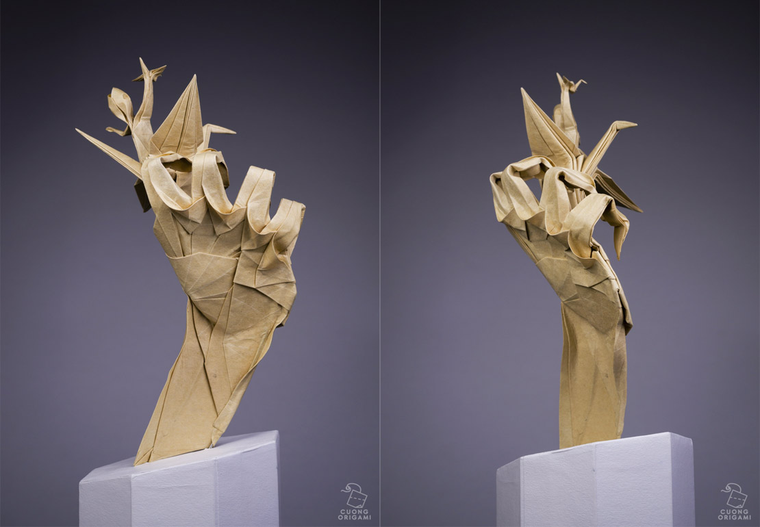 Papierkünstler gestaltet Origami-Skulpturen aus Papier